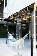 Rosewood Rustic Refuge Pool Outdoor Dining Backyard