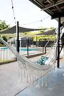 Rosewood Rustic Refuge Pool Outdoor Dining Backyard