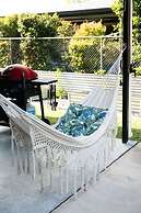 Rosewood Rustic Refuge Pool Outdoor Dining Backyard