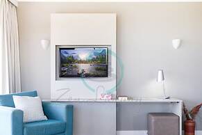 Coastal Elegance Sunset Pool Balcony Dining