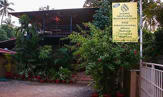 Fabhotel Morjim Cottages