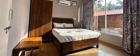 Fabhotel Morjim Cottages