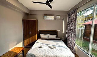 Fabhotel Morjim Cottages