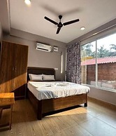 Fabhotel Morjim Cottages