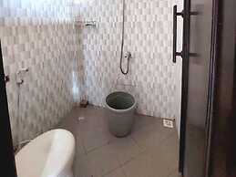 SPOT ON 93880 Guest House Bu Iin Syariah