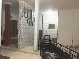 SPOT ON 93880 Guest House Bu Iin Syariah