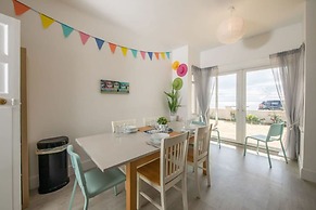 Absolute Beachfront With Decked Garden Oasis and Views