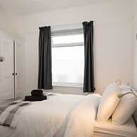 Absolute Beachfront With Decked Garden Oasis and Views