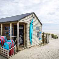 Absolute Beachfront With Decked Garden Oasis and Views