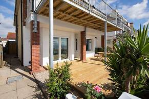 Absolute Beachfront With Decked Garden Oasis and Views