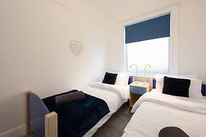 Absolute Beachfront With Decked Garden Oasis and Views