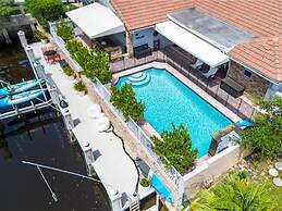 Luxe 4BR Waterfront w Htd Pool 5min to Beach