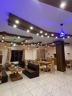 RISING HOTEL