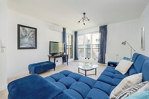 Wroclaw Dark Blue Apartment by Renters