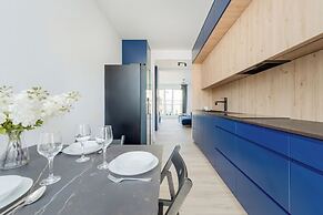Wroclaw Dark Blue Apartment by Renters