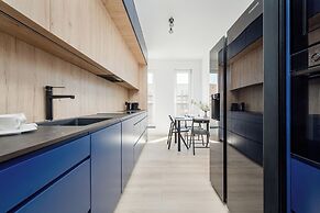 Wroclaw Dark Blue Apartment by Renters