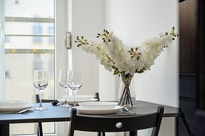 Wroclaw Dark Blue Apartment by Renters