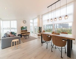 Modern Chalet on the Water at a Holiday Park