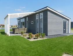 Modern Chalet on the Water at a Holiday Park