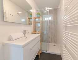 Modern Chalet on the Water at a Holiday Park