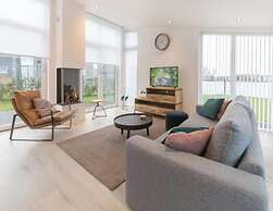 Modern Chalet on the Water at a Holiday Park