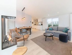 Modern Chalet on the Water at a Holiday Park