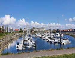 Modern Chalet on the Water at a Holiday Park