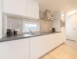 Modern Chalet on the Water at a Holiday Park