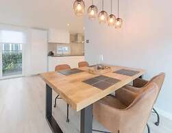 Modern Chalet on the Water at a Holiday Park