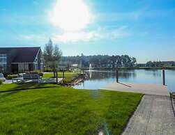 Modern Chalet on the Water at a Holiday Park