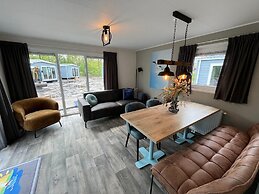 Chalet With Play Equipment, on a Holiday Park