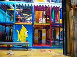 Chalet With Play Equipment, on a Holiday Park