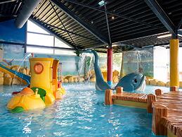 Chalet With Play Equipment, on a Holiday Park