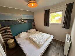 Chalet With Play Equipment, on a Holiday Park