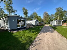Chalet With Play Equipment, on a Holiday Park