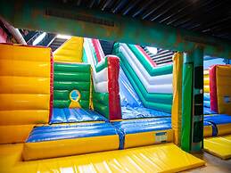 Chalet With Play Equipment, on a Holiday Park