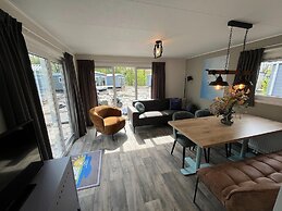 Chalet With Play Equipment, on a Holiday Park