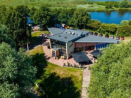 Chalet With Play Equipment, on a Holiday Park