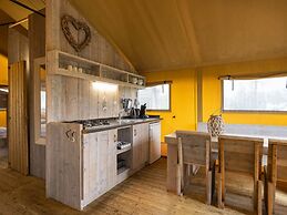 Nice Safari Tent With Bathroom at a Holiday Park Near Lauwersmeer Nati