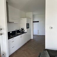 Modern Chalet With a Dishwasher in Lathum