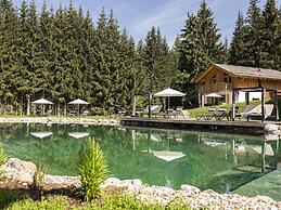 Nice Chalet in Wolting With Natural Swimming Pond