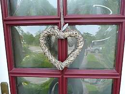 Swallow's Nest in the House by the Pond