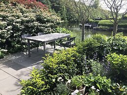 Cozy Forest Villa on the Water Near Harderwijk