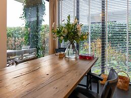 Cozy Forest Villa on the Water Near Harderwijk
