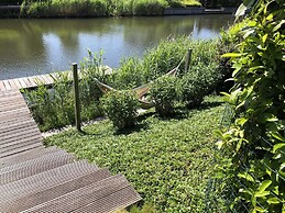 Cozy Forest Villa on the Water Near Harderwijk
