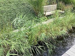 Cozy Forest Villa on the Water Near Harderwijk