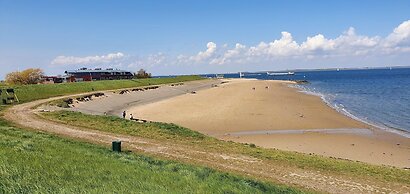 Modern Chalet on the Water at a Holiday Park