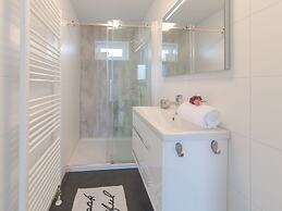 Modern Chalet on the Water at a Holiday Park