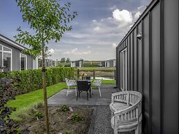 Modern Chalet on the Water at a Holiday Park
