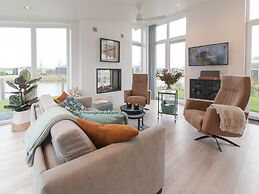 Modern Chalet on the Water at a Holiday Park